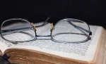 Glasses sitting on a Bible (thumbnail)