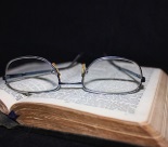 Glasses sitting on a Bible