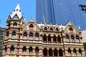 Cathedral from former times, dwarfed by modern skyscrapers